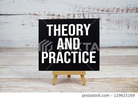 Theory And Practice text with easel on wooden background 129625169