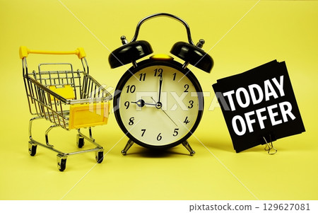 Today Offer text message on sticky note with trolley shopping cart and alarm clock on yellow background Today Offer text message on sticky note with trolley shopping cart and alarm clock on yellow background 129627081