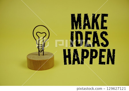 Make Ideas Happen text message on yellow background 129627121
