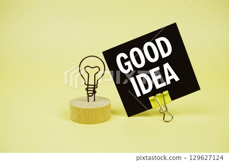 Good Idea text message on sticky note with on yellow background Good Idea text message on sticky note with on yellow background 129627124