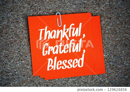 Thankful, Grateful, Blessed text message on stick note on cork paper background 129628856