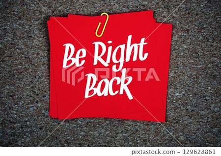 Be Right Back text message on stick note on cork paper background Be Right Back text message on stick note on cork paper background 129628861