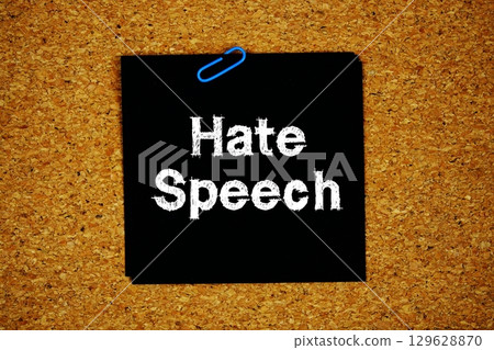 Hate Speech text message on stick note on cork paper background 129628870