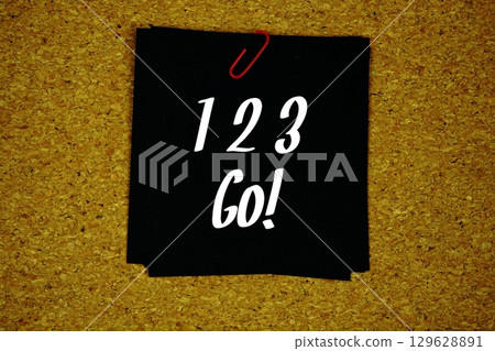 1 2 3 Go! text message on sticky note on cork paper background 129628891