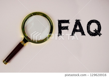 FAQ text with magnifying glass on pink background 129628916