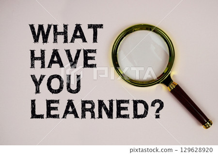 What Have You Learned? text with magnifying glass on pink background What Have You Learned? text with magnifying glass on pink background 129628920