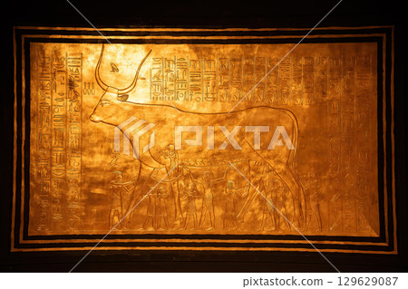 Golden Artwork of Egyptian Cow Goddess Hathor with Ancient Hieroglyphs Golden Artwork of Egyptian Cow Goddess Hathor with Ancient Hieroglyphs 129629087