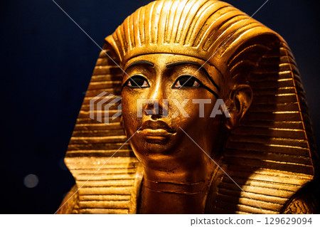 Golden Funerary Mask Of Tutankhamen. Tutankhamun Famous Pharaoh In Ancient Egypt Golden Funerary Mask Of Tutankhamen. Tutankhamun Famous Pharaoh In Ancient Egypt 129629094