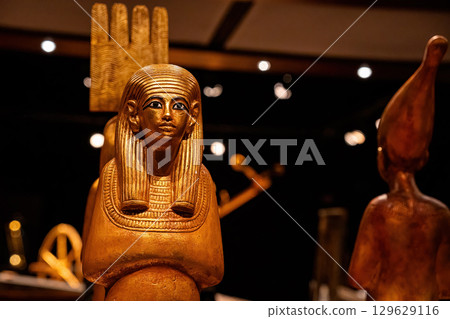 Royal Golden Statue Of Ancient Egyptian Pharaoh, Ancient Exhibit In Museum Royal Golden Statue Of Ancient Egyptian Pharaoh, Ancient Exhibit In Museum 129629116