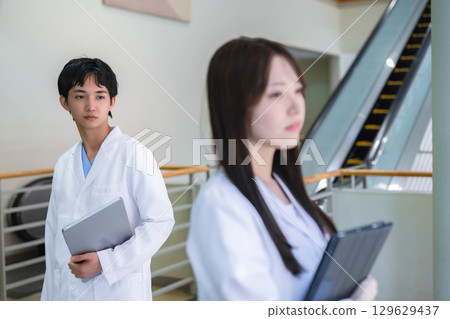 Doctor wearing white coat Doctor wearing white coat 129629437