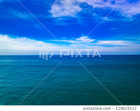 Aerial view of a sea surface water texture background and sun reflections Aerial flying drone view Waves water surface texture on sunny tropical ocean 129629522