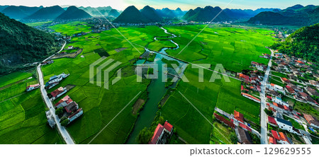 Aerial top view of Green rice field at northern vietnam,Beautiful destination in Northern Vietnam,Travel and landscape concept, Nature and rice fields background 129629555