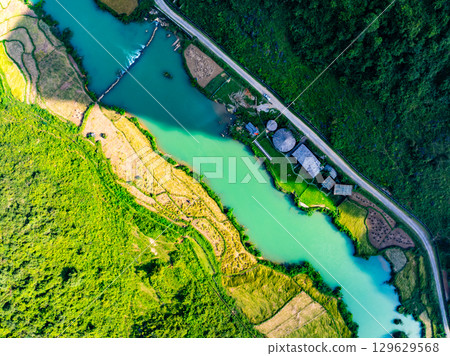 Aerial top view of Green rice field at northern vietnam,Beautiful destination in Northern Vietnam,Travel and landscape concept, Nature and rice fields background 129629568
