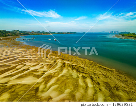 Aerial view of sandbar with turquoise sea at Laem had Koh khao yai Phang Nga Thailand, summer background and summer holiday concept Aerial view of sandbar with turquoise sea at Laem had Koh khao yai Phang Nga Thailand, summer background and summer holiday concept 129629581