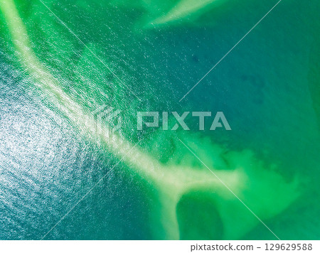 Aerial view of sandbar with turquoise sea at Laem had Koh khao yai Phang Nga Thailand, summer background and summer holiday concept Aerial view of sandbar with turquoise sea at Laem had Koh khao yai Phang Nga Thailand, summer background and summer holiday concept 129629588