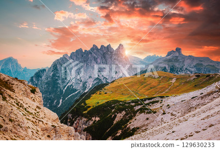 Mountainous terrain with a rocky massif in the Italian Alps in the early morning. South Tyrol, Europe. 129630233