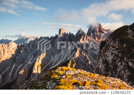 Grand rock pillars of Cadini di Misurina in the morning. Location place Tre Cime di Lavaredo, Italian Alps, South Tyrol, Europe. 129630235