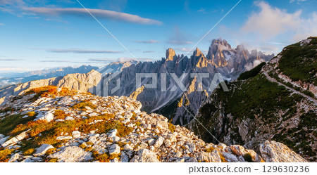 Grand rock pillars of Cadini di Misurina in the morning. Location place Tre Cime di Lavaredo, Italian Alps, South Tyrol, Europe. Grand rock pillars of Cadini di Misurina in the morning. Location place Tre Cime di Lavaredo, Italian Alps, South Tyrol, Europe. 129630236