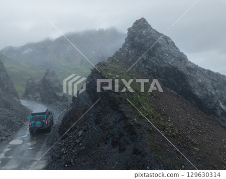 Driving off road car in high altitude mountains in tibet, China Driving off road car in high altitude mountains in tibet, China 129630314