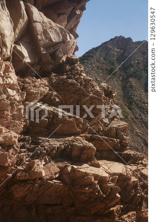 Textured Rock Formation with Unique and Distinctive Patterns and Features Embedded Within Textured Rock Formation with Unique and Distinctive Patterns and Features Embedded Within 129630547