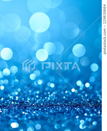 Sparkling light blue bokeh background material 129630664
