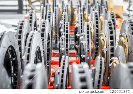 Checking car brake system for repair at car garage 129631875