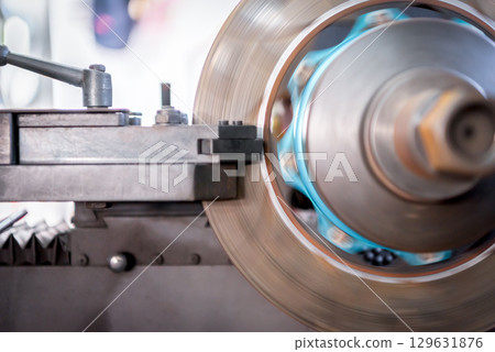Checking car brake system for repair at car garage Checking car brake system for repair at car garage 129631876