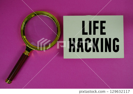 Life Hacking text written on paper with magnifying glass Life Hacking text written on paper with magnifying glass 129632117