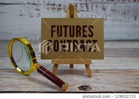 Futures Contract text written on paper with magnifying glass Futures Contract text written on paper with magnifying glass 129632153