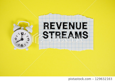 Revenue Streams text written on paper with alarm clock on yellow background Revenue Streams text written on paper with alarm clock on yellow background 129632163