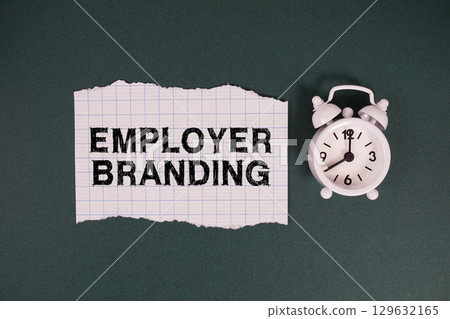 Employer Branding text written on paper with alarm clock on green background Employer Branding text written on paper with alarm clock on green background 129632165