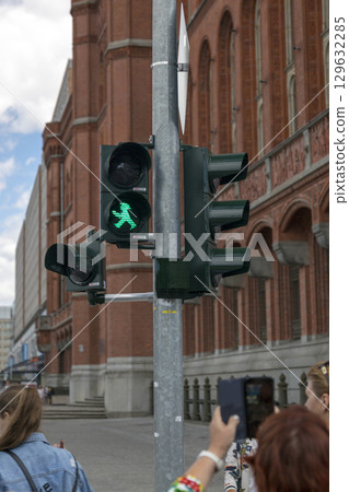 Berlin, Germany - July 01, 2018: Ampelmann is the symbol shown on pedestrian signals in Germany Berlin, Germany - July 01, 2018: Ampelmann is the symbol shown on pedestrian signals in Germany 129632285
