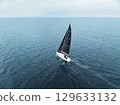 Drone aerial view of a yacht floating on the sea 129633132