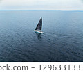 Drone aerial view of a yacht floating on the sea 129633133