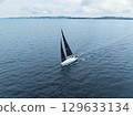 Drone aerial view of a yacht floating on the sea 129633134