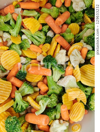 assorted frozen vegetables. Healthy food, vegetarian cuisine. chopped frozen vegetables mix, broccoli, carrots 129633232