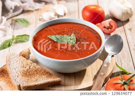 Homemade Tomato Soup in bowl with Basil Homemade Tomato Soup in bowl with Basil 129634077