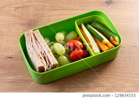 Healthy Lunchbox for school with sandwich,fruit and vegetables 129634153