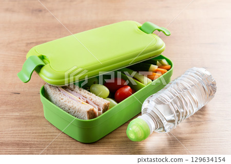 Healthy Lunchbox for school with sandwich,fruit and vegetables 129634154