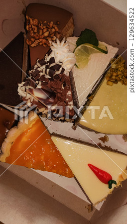 Delicious assorted cake slices filling a pastry box in prague 129634522