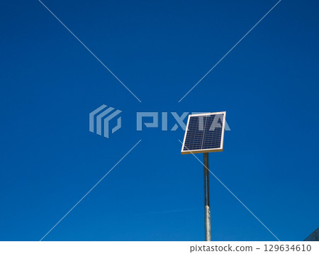 Small solar panel generating renewable energy under blue sky copy space Small solar panel generating renewable energy under blue sky copy space 129634610