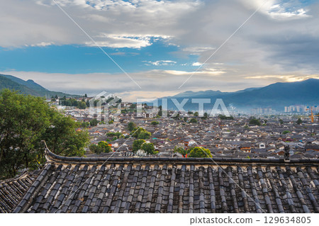 Overlooking Rooftops and Mountains from Lijiang Old Town, Yunnan, China 129634805
