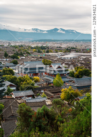 Mufu Palace in Lijiang Old Town with Mountains in the Background 129634821