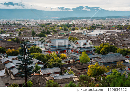 Mufu Palace in Lijiang Old Town with Mountains in the Background Mufu Palace in Lijiang Old Town with Mountains in the Background 129634822
