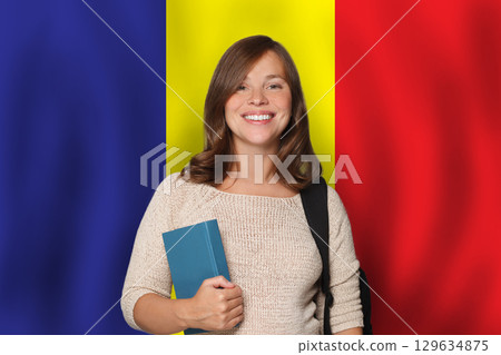 Successful woman student against Romanian flag background. Travel, education Successful woman student against Romanian flag background. Travel, education 129634875