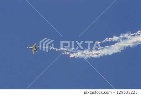 Sukhoi Su-30MK2 Fighter  Of Vietnam People's Air Force Releases Flares On The Sky At The 50th Anniversary Of The Reunification Day. 129635223