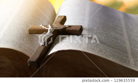Wooden Jesus Cross on Old Book Wooden Jesus Cross on Old Book 129635559