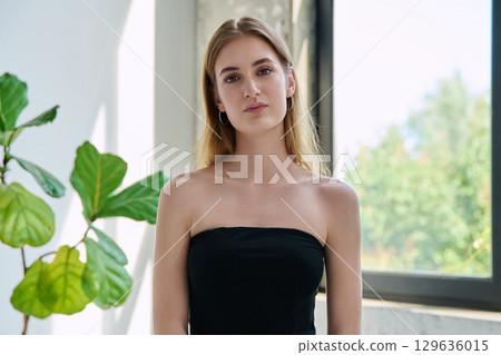Portrait of beautiful fashionable young blonde woman with long hair Portrait of beautiful fashionable young blonde woman with long hair 129636015
