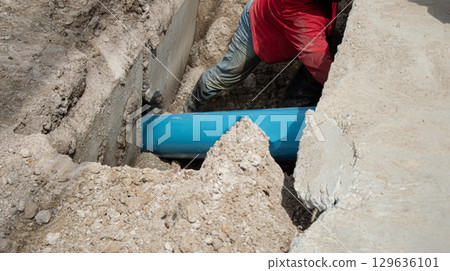 Workers are installing PVC pipes. 129636101