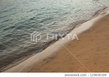 Close up of a deserted beach in summer Close up of a deserted beach in summer 129636109
